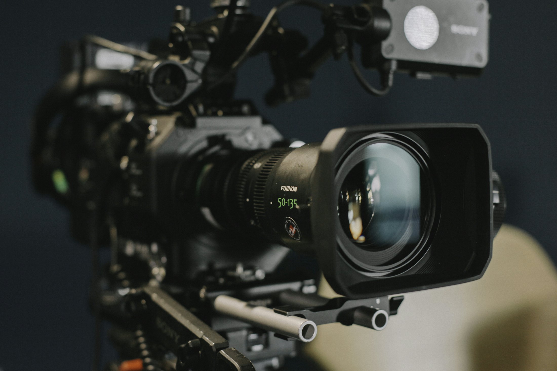 Broadcast camera with a zoom lens in a studio