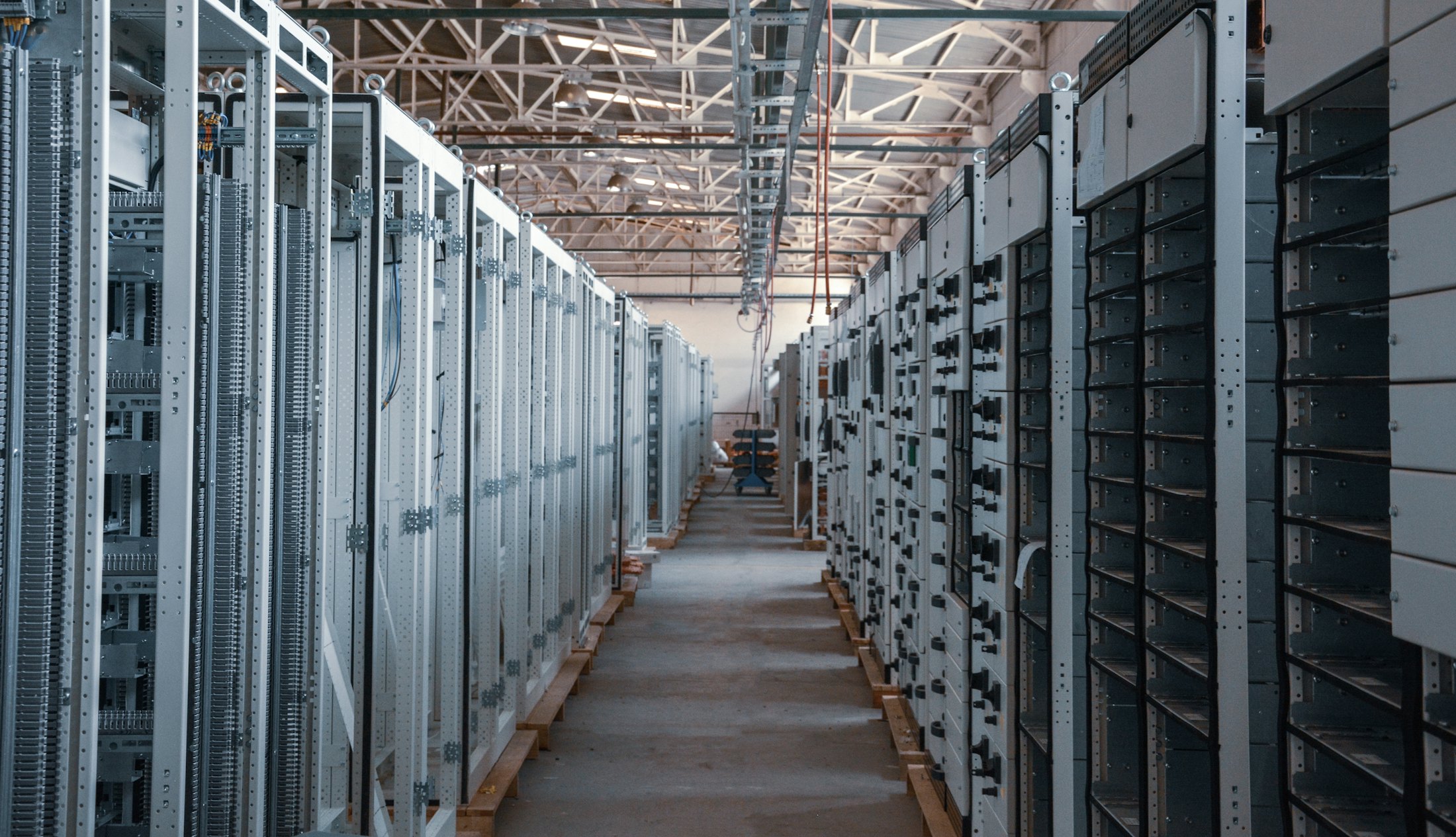 Data centre aisle lined with server racks